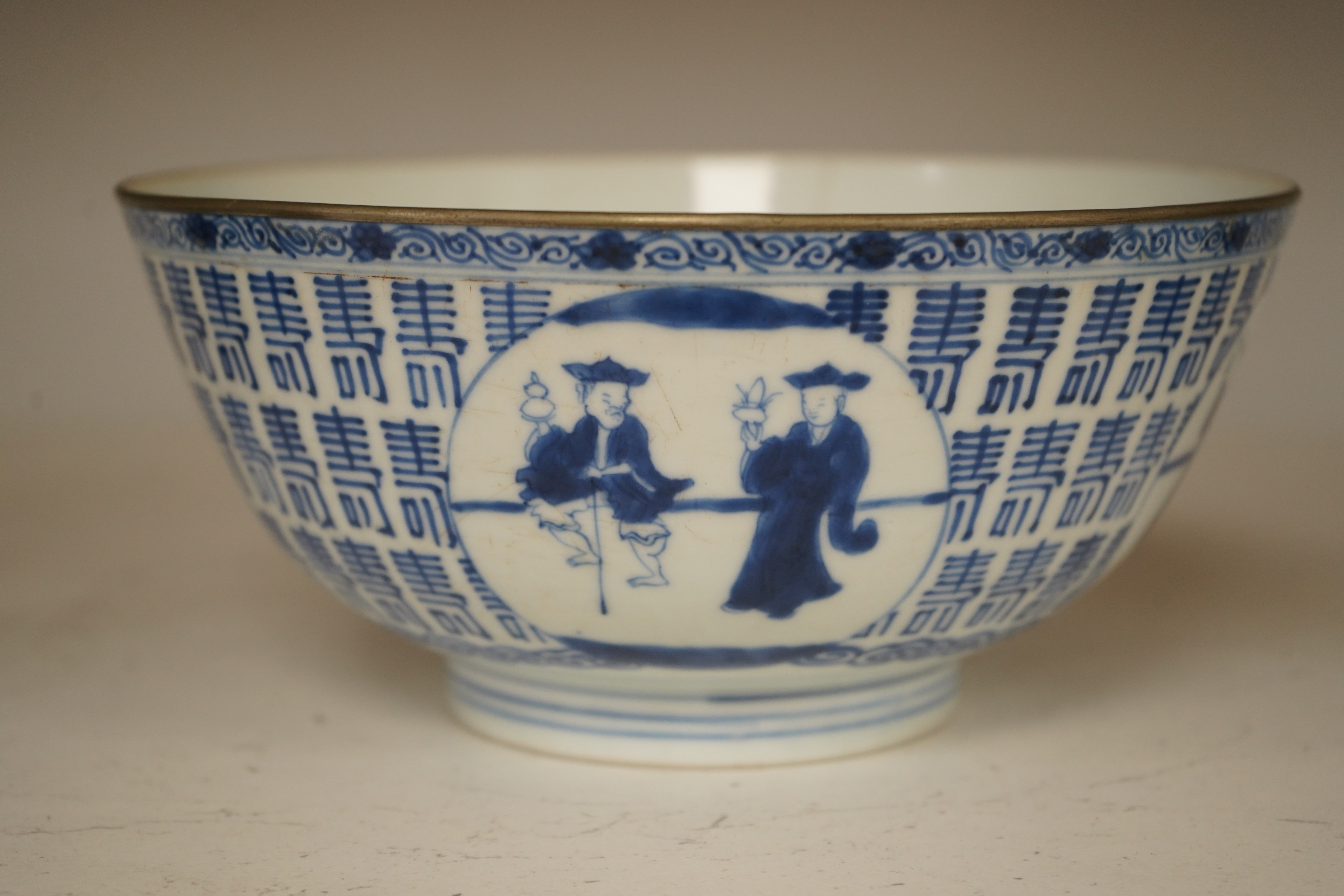 A Chinese blue and white ’Hundred Shou’ bowl, Qing dynasty, 20cm in diameter. Condition - cracked